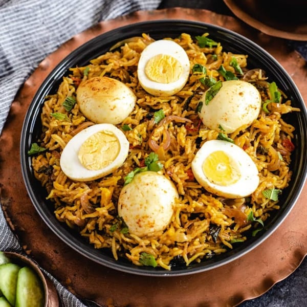Dakshin Indian Bistro's egg biryani, a flavorful rice dish with whole and halved hard-boiled eggs.